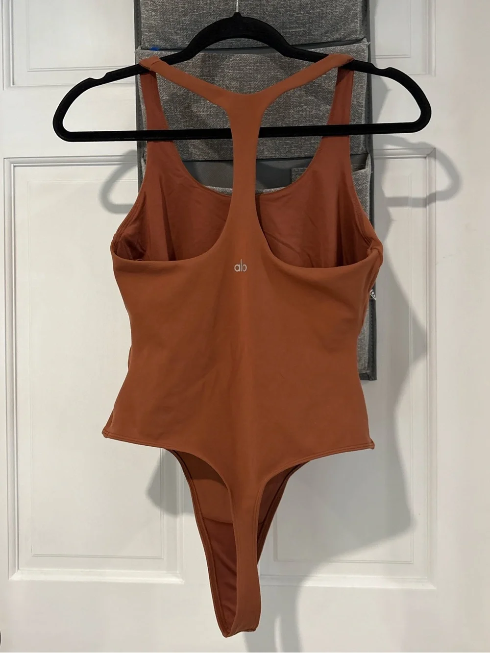 Alo Yoga Sleek Back Bodysuit in Rust Large